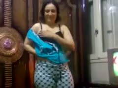 An Arab enchantress reveals her glitzy body while stripping nude.